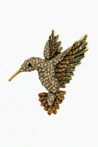 Goudkleurige broche met vogel