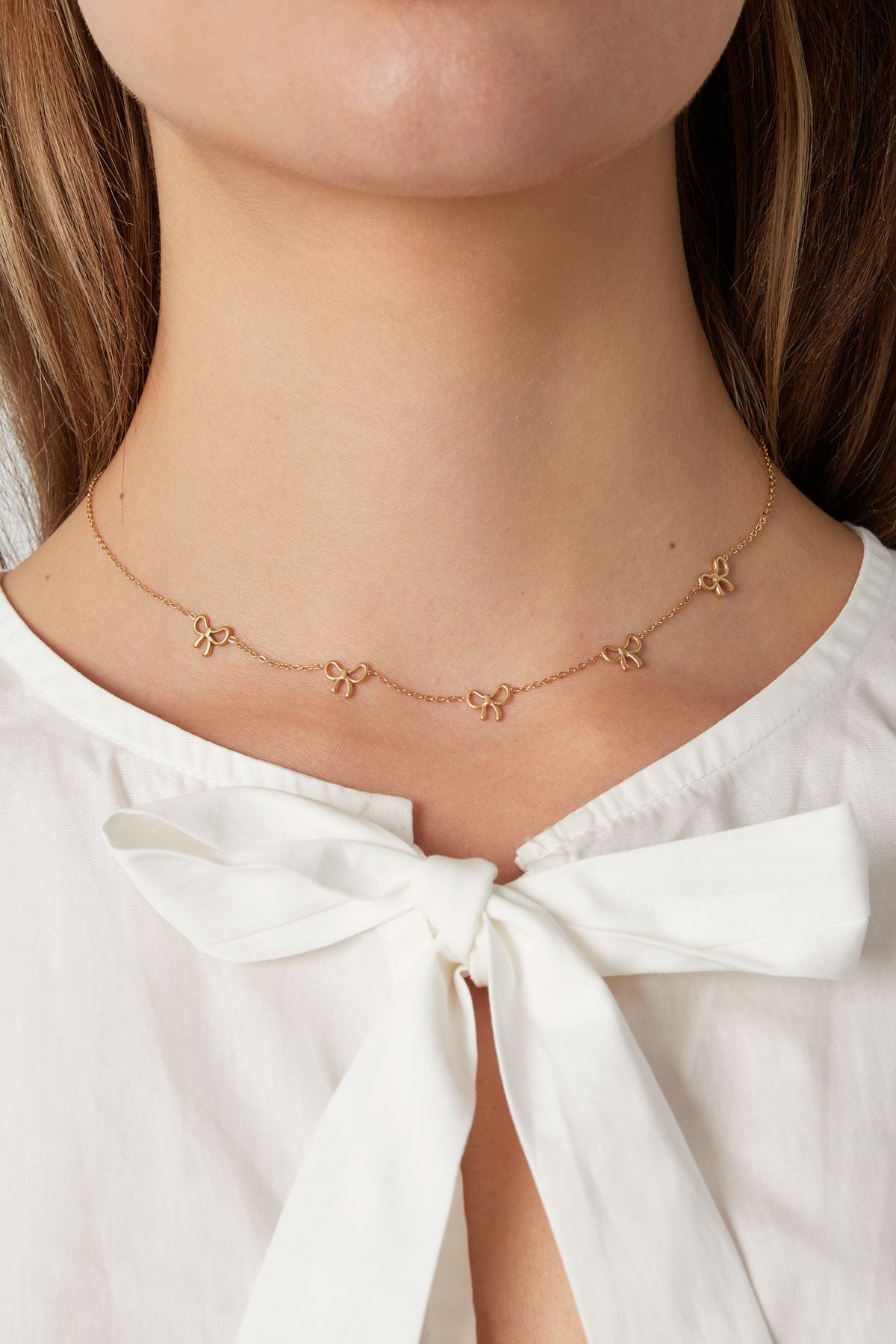 Minimalistische ketting met strikjes